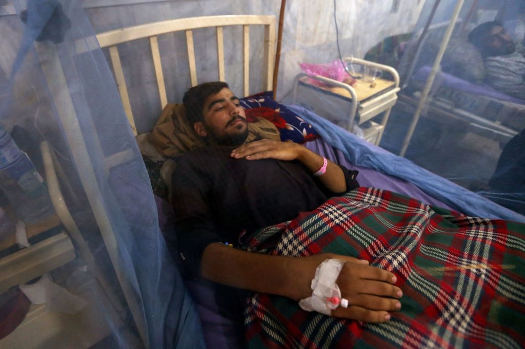 A patient suffering from dengue fever receives medical treatment at an isolation ward in a hospital in Peshawar, Pakistan.