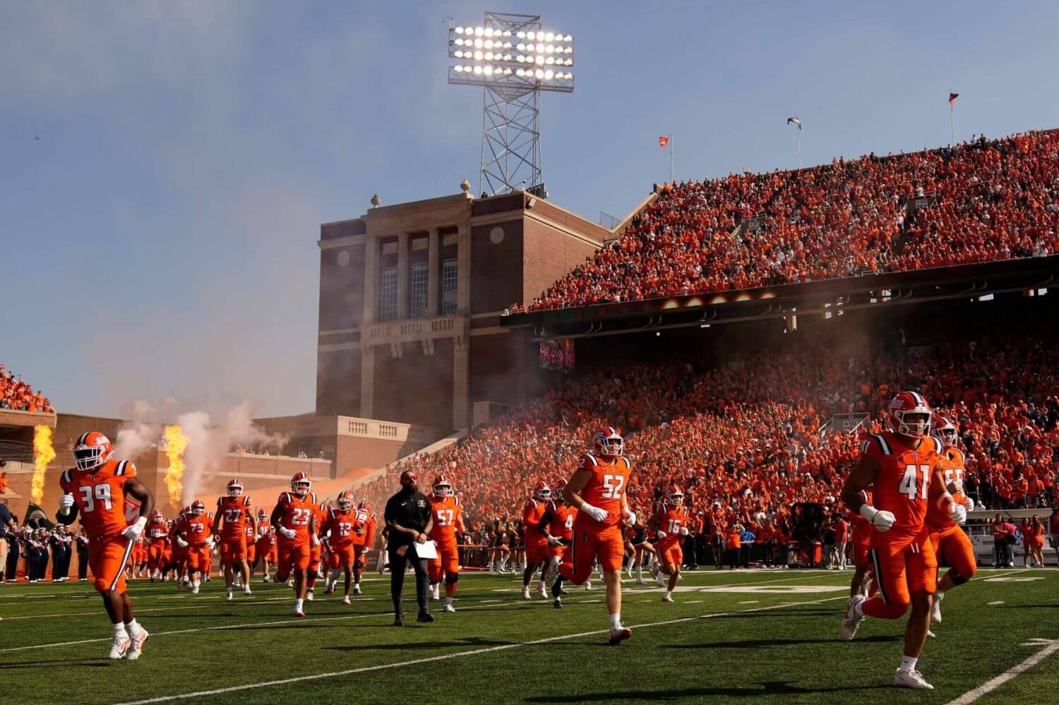 The Illinois football team takes the field at Gies Memorial Stadium before a 2025 home game against Ohio State.