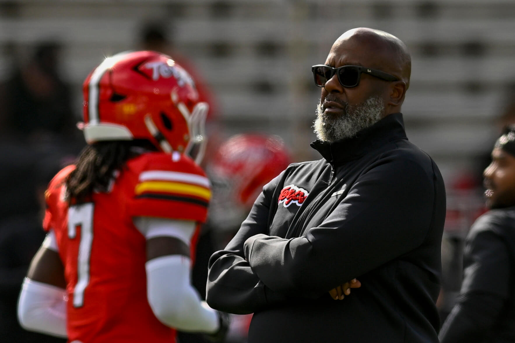 Mike Locksley looks onto the field.