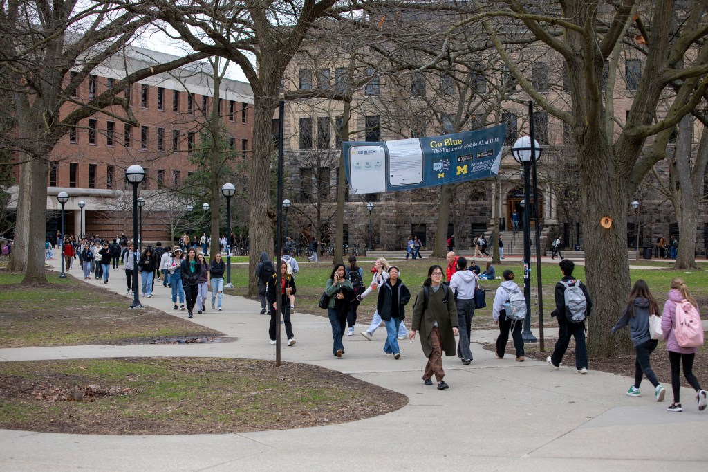 University of Michigan students walk on the UM campus on Thursday, April 3, 2025, in Ann Arbor,