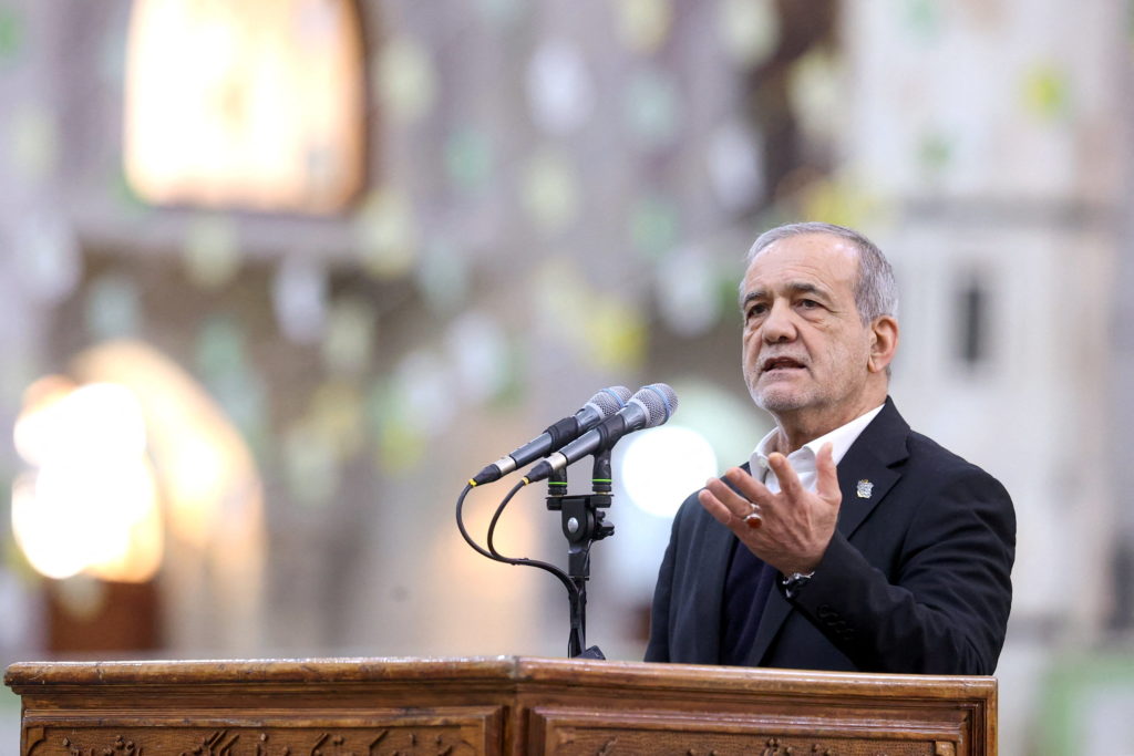 Iranian President Masoud Pezeshkian speaks during a visit to the shrine of the leader of Iran's 1979 Islamic Revolution, A...