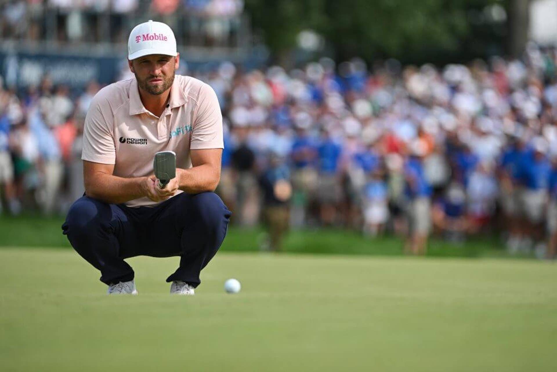 Wyndham Clark lines up his putt on the 18th green during the final round of the BMW Championship.