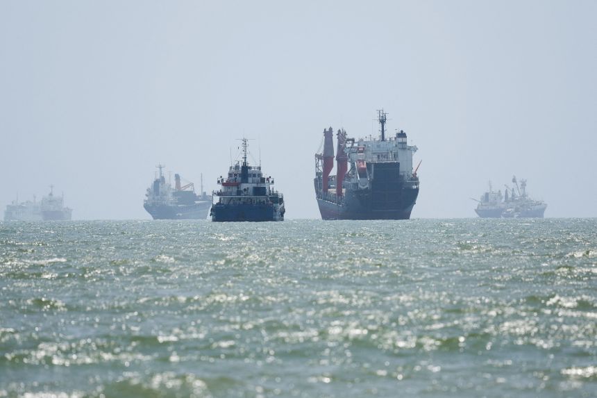 Vessels in the Strait of Hormuz are seen near the beach of Bandar Abbas, Iran, on Tuesday.