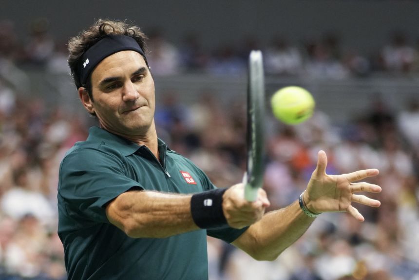 Federer plays an exhibition doubles match at the US Open on Tuesday. He teamed up with John McEnroe to take on Andre Agassi and Andy Roddick.