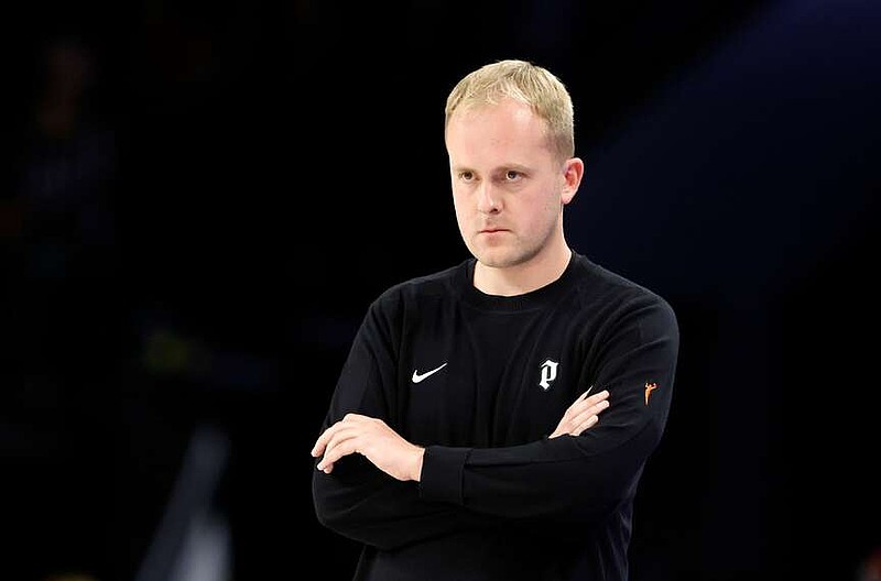 Portland Fire head coach Alex Sarama watches play during the first half of an WNBA basketball game between the Las Vegas Aces and the Fire, Tuesday, July 28, 2026, in Las Vegas. (Steve Marcus/Las Vegas Sun via AP)