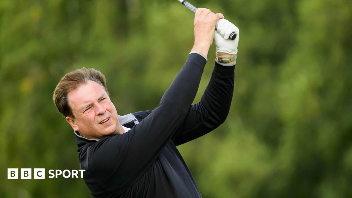 Amateur golfer Allan Harrison watches his ball after hitting a shot