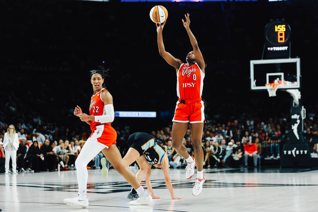 Aces center A'ja Wilson (22) looks to see if a referee will call a foul as New York Libert ...