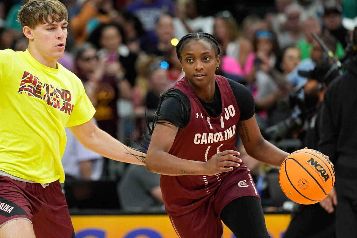 South Carolina guard Ta'niya Latson (00) drives during a practice at the NCAA college bask ...