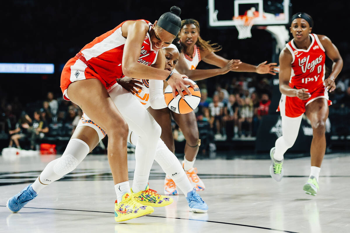 Connecticut Sun guard Kennedy Burke (25) tries to steal the ball from Aces center A'ja Wil ...