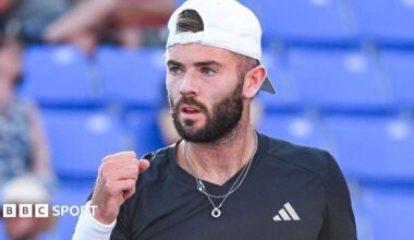 Jacob Fearnley clenches his fist in celebration after winning a point