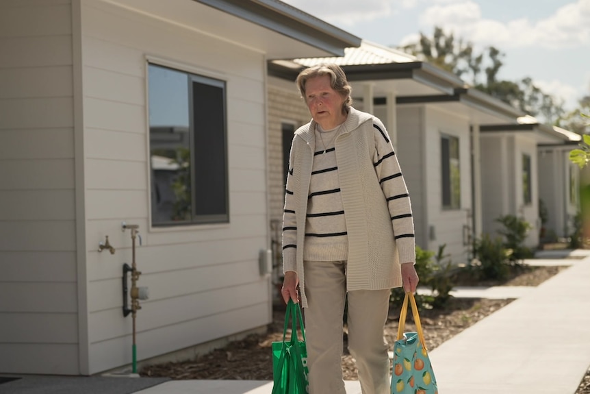 woman carrying shopping bags