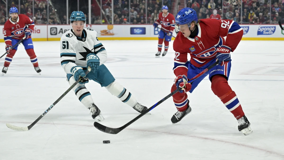 Montreal Canadiens forward Patrik Laine (92) plays the puck and San Jose Sharks forward Collin Graf (51) defends during the second period at the Bell Centre.