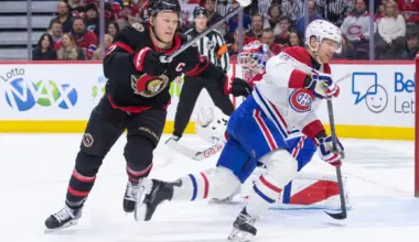 Ottawa Senators left wing Brady Tkachuk (7) and Montreal Canadiens defenseman Mike Matheson (8) chase the puck in the first period at the Canadian Tire Centre.