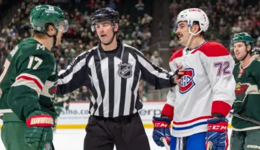 linesman Kyle Flemington (55) breaks up Minnesota Wild left wing Marcus Foligno (17) and Montreal Canadiens defenseman Arber Xhekaj (72) during an altercation in the third period at Xcel Energy Center.