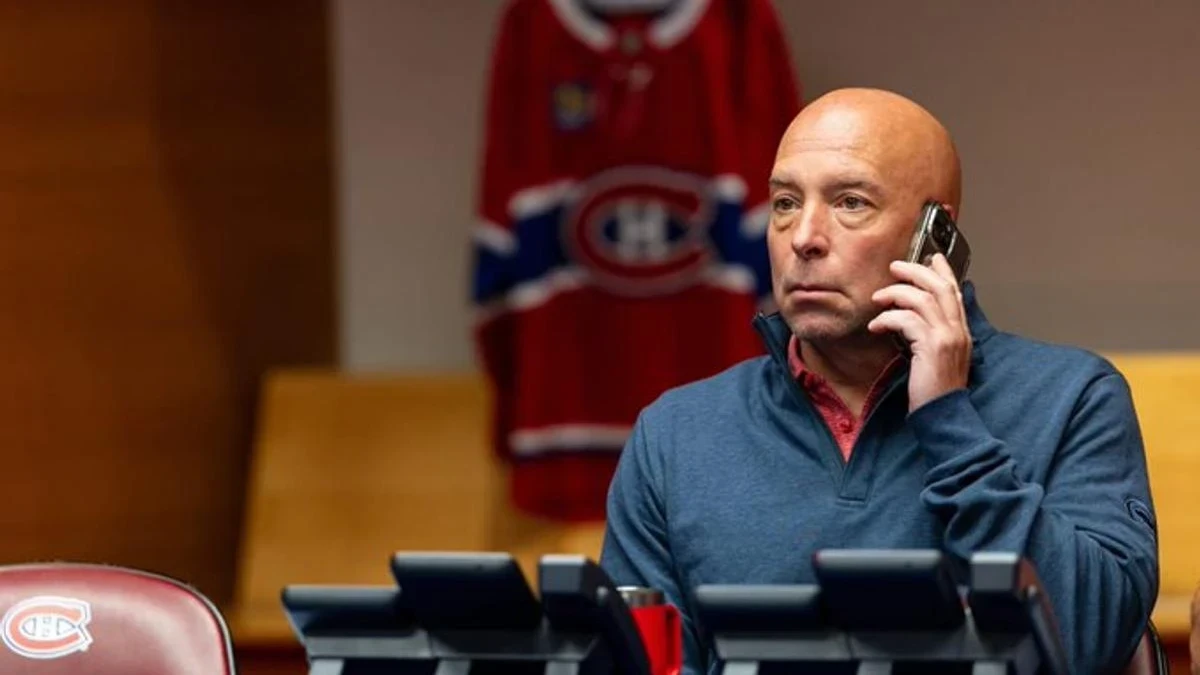Photo of Montreal Canadiens general manager Kent Hughes on the phone during the NHL draft.