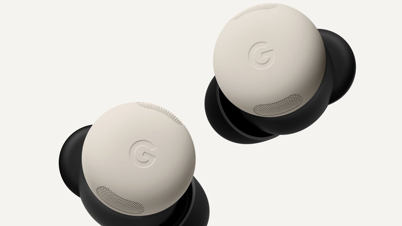 Two beige Google wireless earbuds with black bases floating on a light background, showing the subtle G logo and small speaker grilles on each earbud