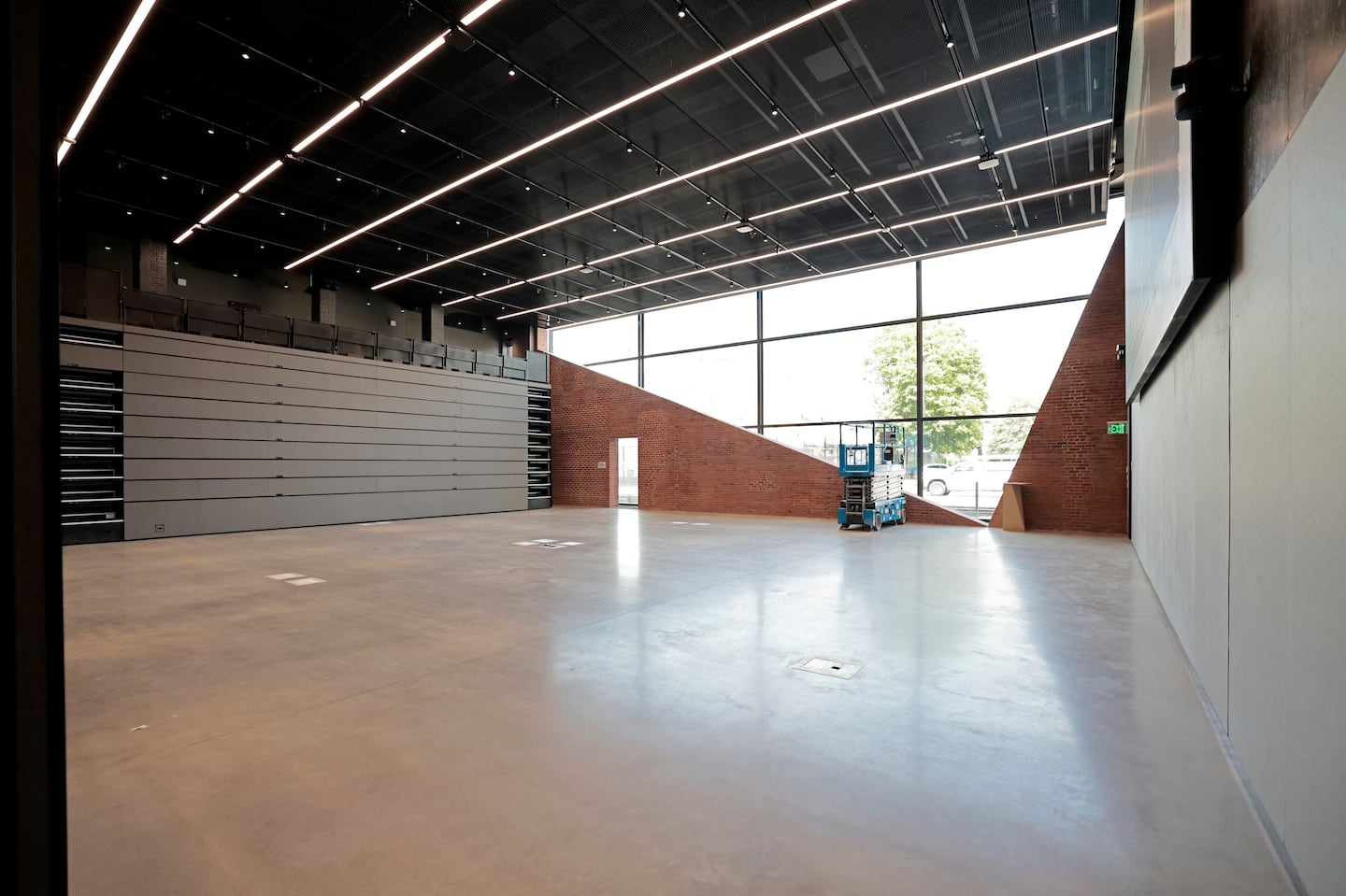 Auditorium space with retractable seating inside the MIT School of Architecture and Planning's new Metropolitan Storage Warehouse home.
