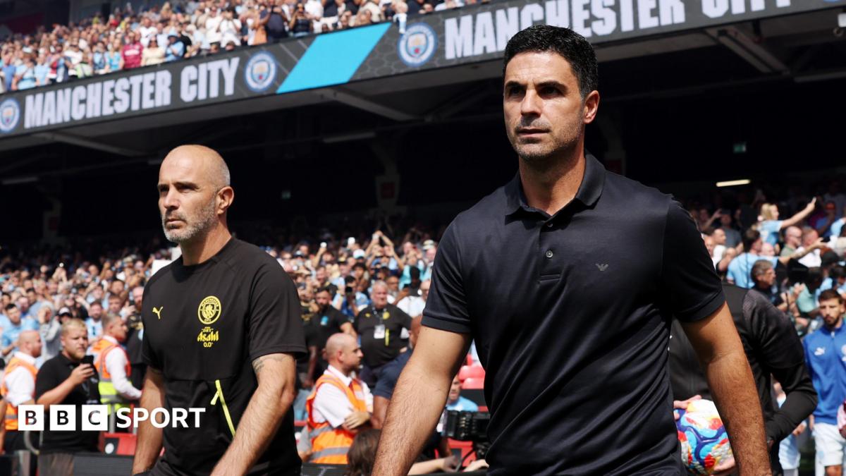 Manchester City manager Enzo Maresca (left) and his Arsenal counterpart Mikel Arteta take to the pitch ahead of the 2026 FA Community Shield.