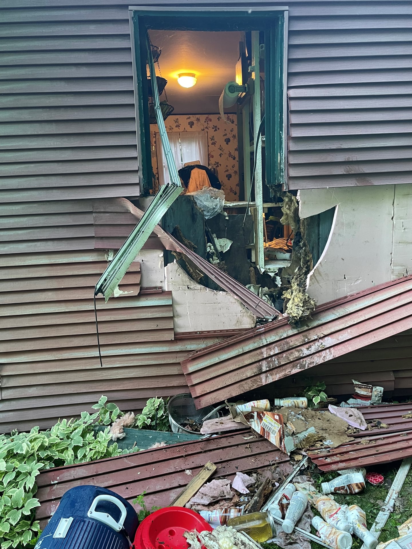 Damage to a Vermont home in 2022 after a bear sought to enter it.