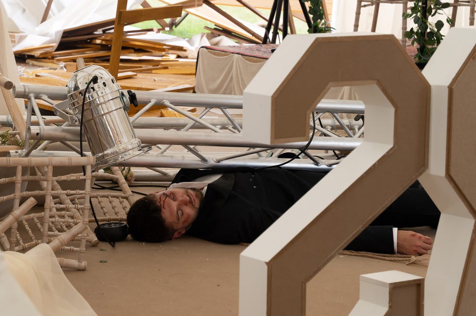 emmerdale joe tate on the floor of the wedding underneath some collapsed deco truss