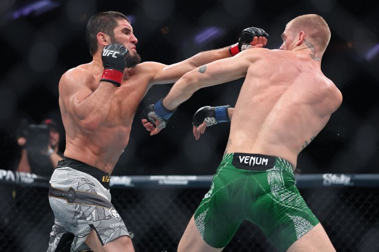 Makhachev punches Ian Machado Garry, right, in their welterweight title bout during UFC 330 at Xfinity Mobile Arena on August 15, 2026, in Philadelphia, Pennsylvania, US
