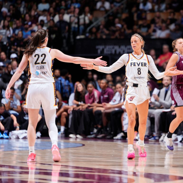Caitlin Clark, left, and Sophie Cunningham of the Indiana Fever high five during the game against the Toronto Tempo on August 18, 2026 at Scotiabank Arena in Toronto, Canada