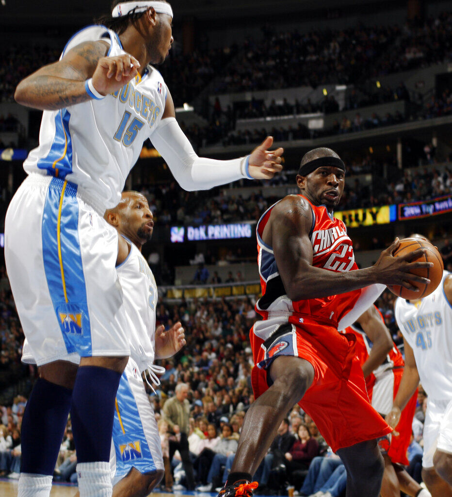 Charlotte Bobcats guard Jason Richardson, right, heads up for a shot as Denver Nuggets forward Carmelo Anthony, front left, and guard Anthony Carter come in to cover in the third quarter of the Nuggets' 117-101 victory in an NBA basketball game in Denver on Saturday, Feb. 2, 2008. (AP Photo/David Zalubowski)
