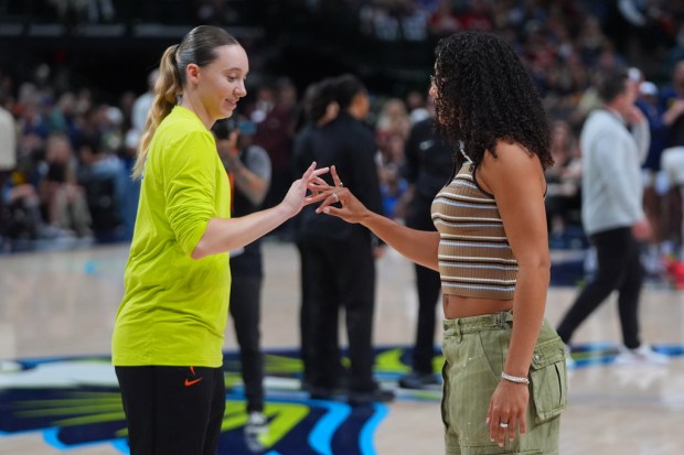 An inured Dallas Wings guard Azzi Fudd, right, and guard Paige Bueckers before the first half of a WNBA basketball game against the Indiana Fever in Dallas, Thursday, Aug. 20, 2026. (AP Photo/LM Otero)