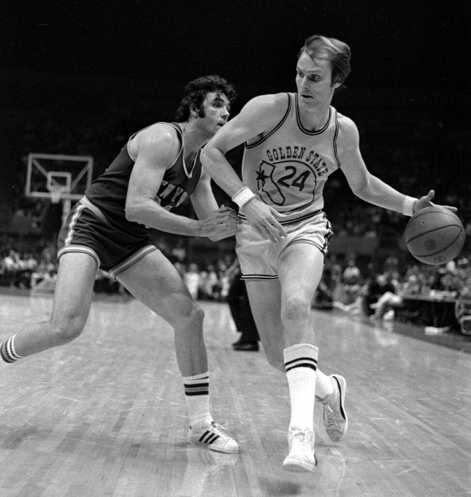 *Golden State Warriors Rick Barry (24) drives past the New York Knicks Dave DeBusschere (22) in this file photo taken in Oakland, Calif. March 14, 1974.  (AP Photo/Sal Veder)