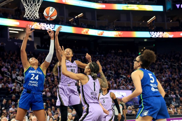 Golden State Valkyries' Kiah Stokes (41) and Minnesota Lynx's Napheesa Collier (24) struggle for a rebound in the second quarter of a WNBA game at Chase Center in San Francisco, Calif., on Wednesday, Aug. 19, 2026. (Ray Chavez/Bay Area News Group)