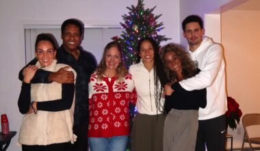 Golden State Valkyries guard Veronica Burton (third from right) poses for a holiday photo with her parents, two sisters and brother.