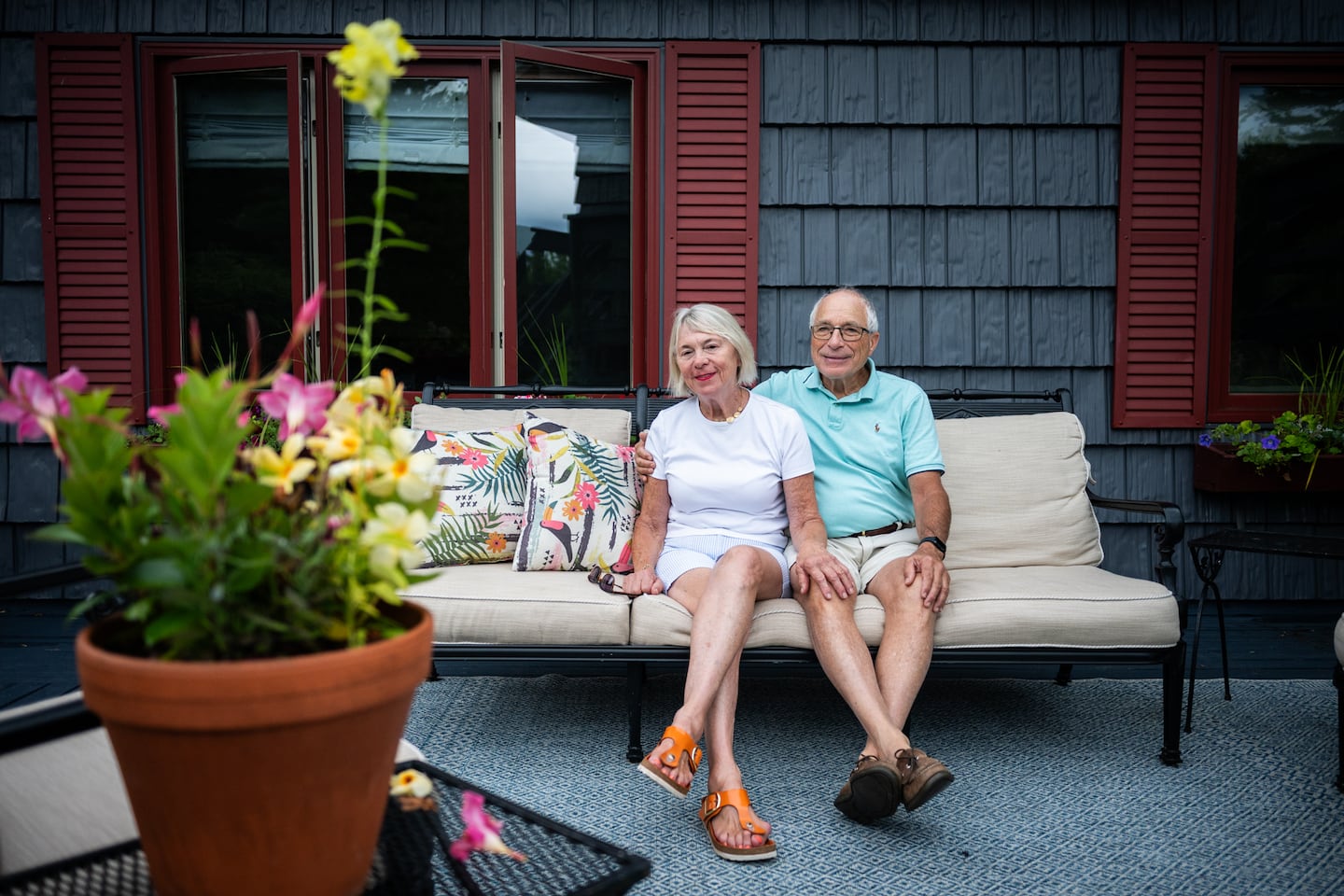 Suzanne Szermer and Louis May sat on the deck in front of the window that a bear broke into earlier this summer in Stowe, Vt.