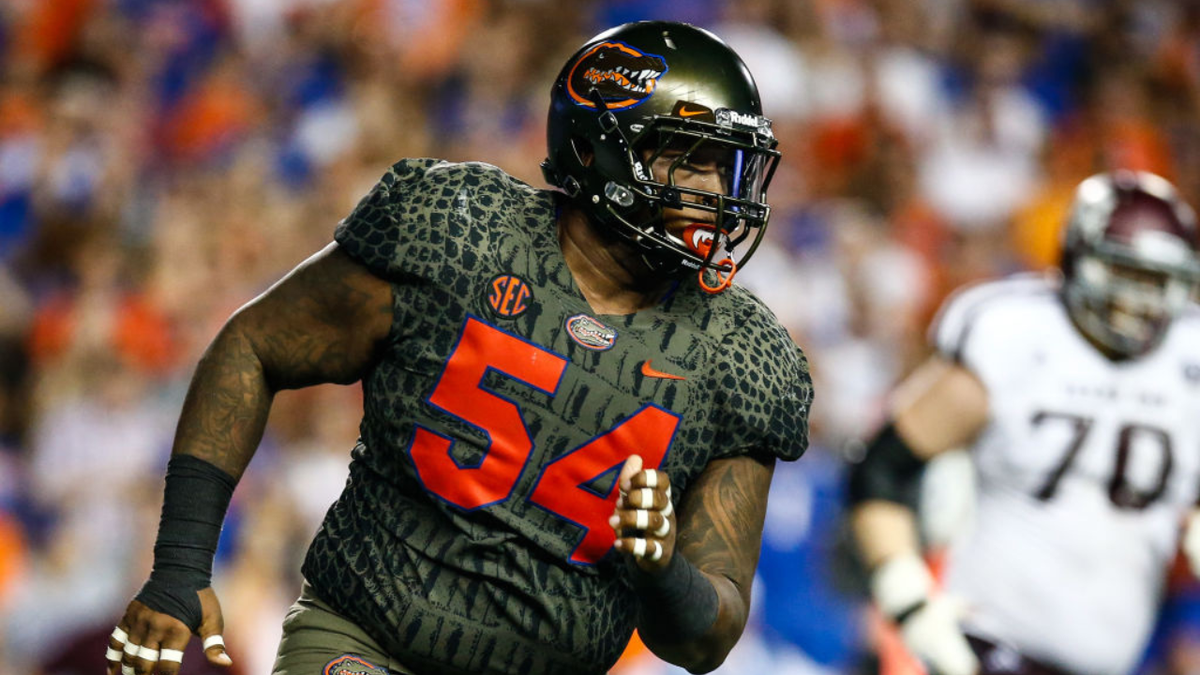 Khairi Clark runs during a football game in Gainesville, Fla.
