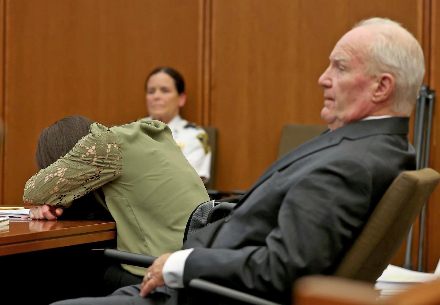 Defense attorney Kevin Reddington, right, listens to graphic testimony as his client, Lindsay Clancy sobs, during Clancy's murder trial at Plymouth Superior Court in Plymouth, Mass., Wednesday, Aug. 12, 2026. 
