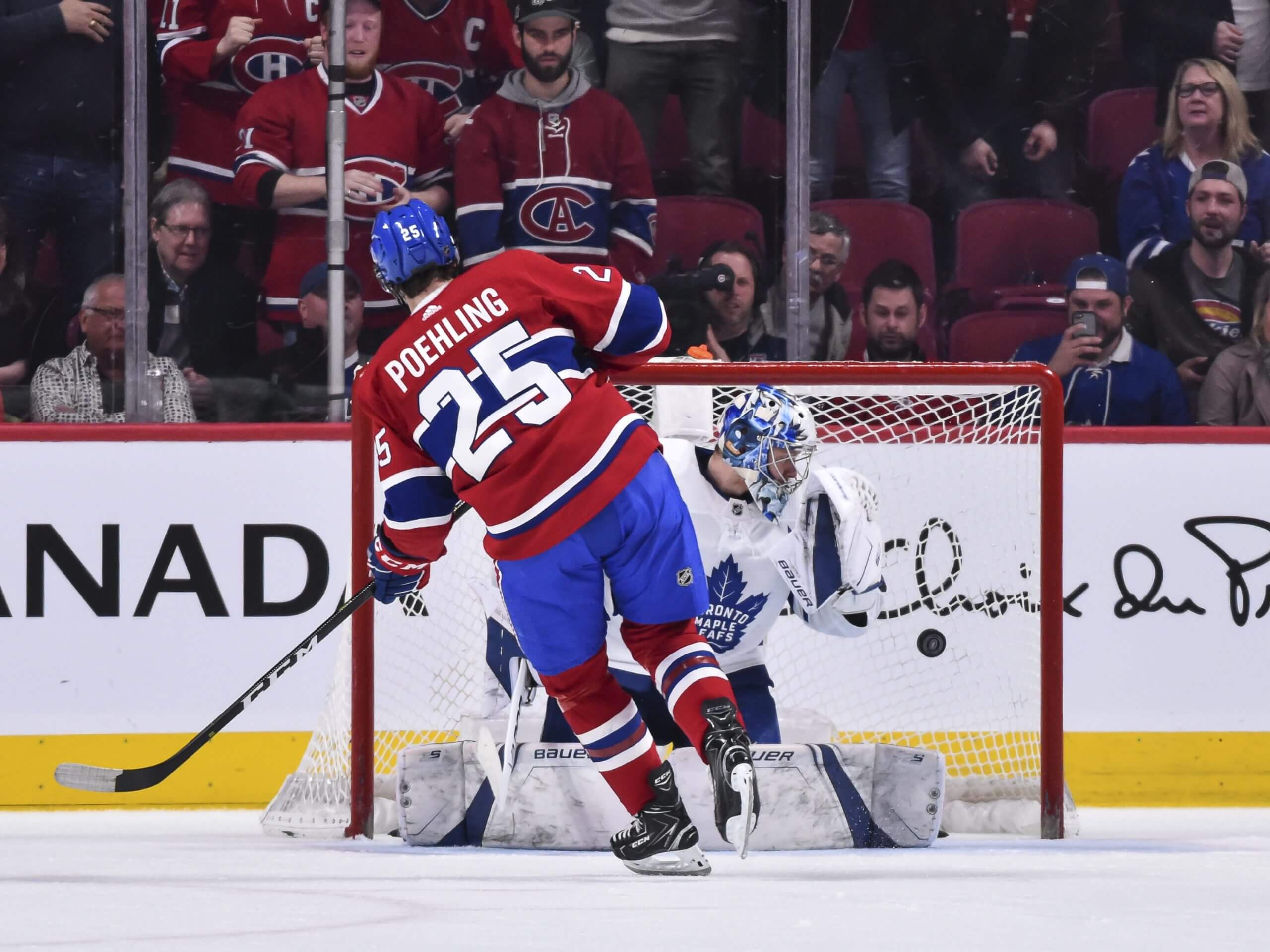 Ryan Poehling, seen from behind, skates toward the Leafs net, where goalie Frederik Andersen watches the puck sail past him into the net.