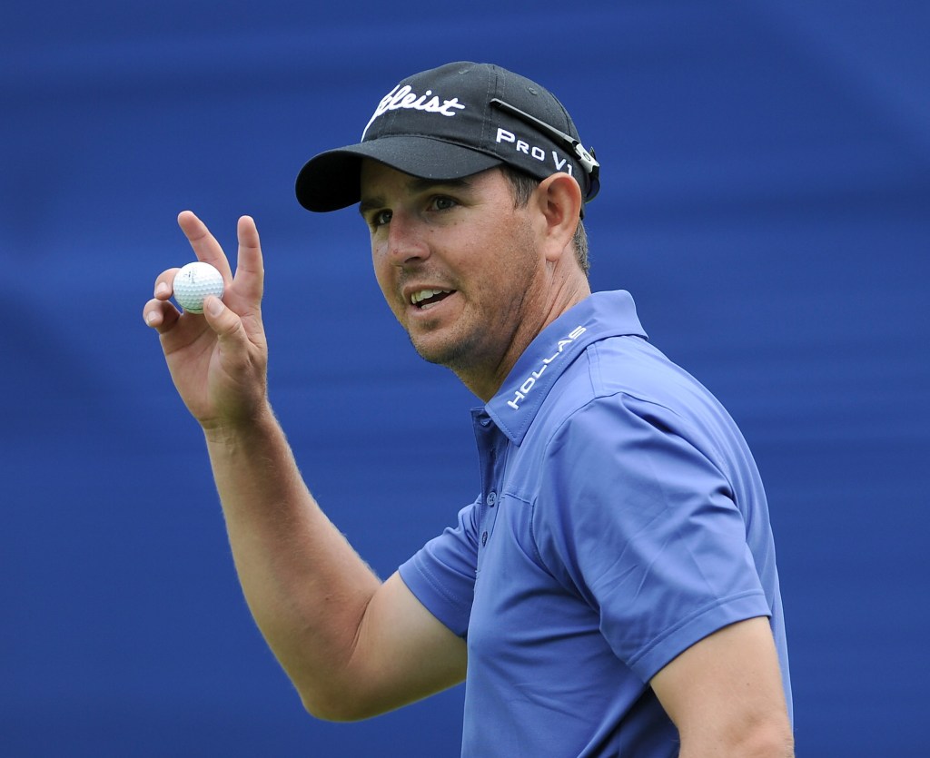Matt McQuillan of Canada celebrates his par to finish two under for the day during round one of the RBC Canadian Open at the Shaughnessy Golf & Country Club on July 21, 2011 in Vancouver, Canada.  