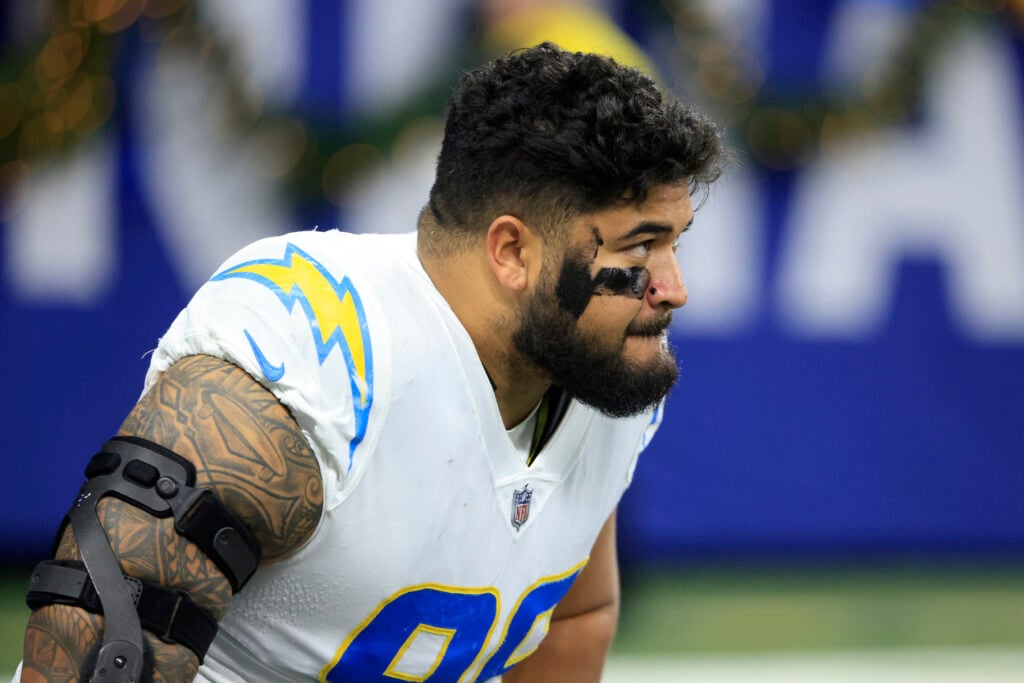 Breiden Fehoko #96 of the Los Angeles Chargers warms up prior to the game against the Indianapolis Colts at Lucas Oil Stadium.