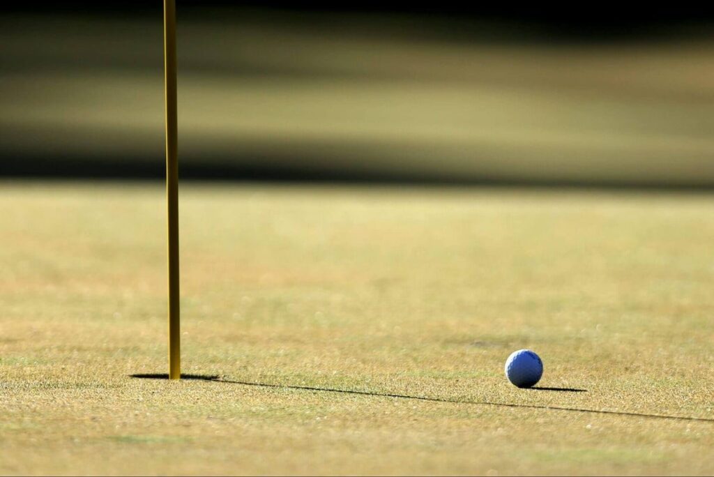 A general view of a golf ball on a green.