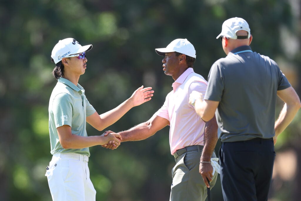 Min Woo Lee and Tiger Woods shake hands after a practice round prior to the U.S. Open at Pinehurst