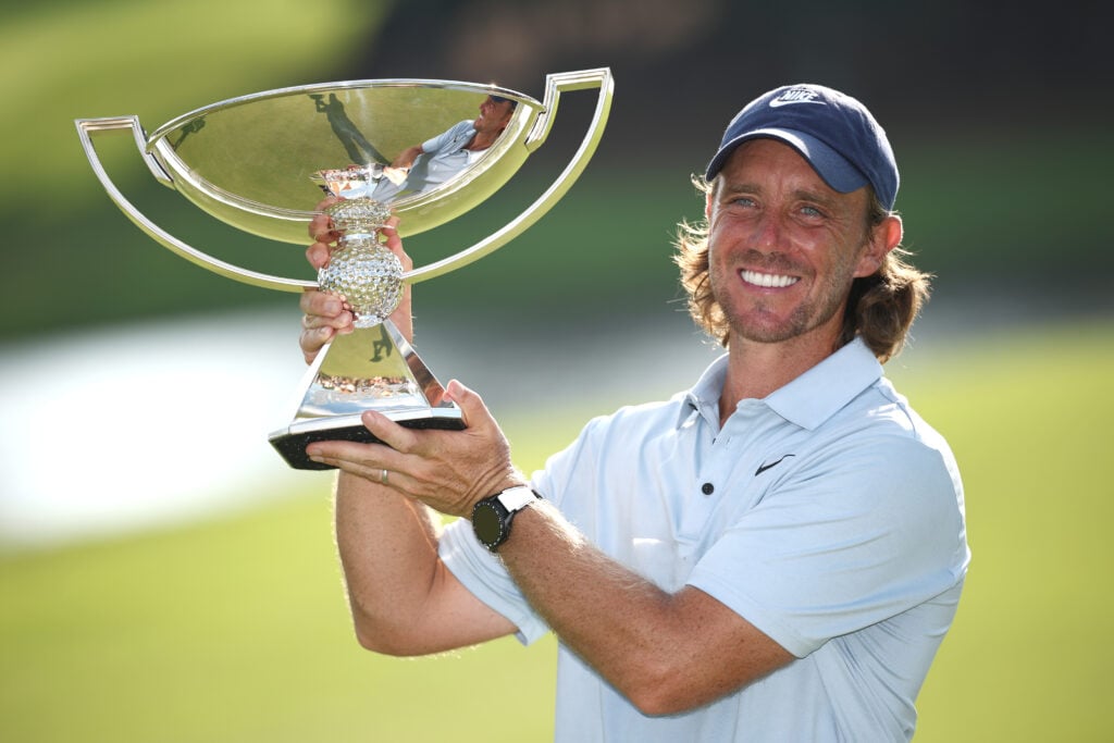 Tommy Fleetwood of England poses with the Fedex Cup trophy after winning the final round of the TOUR Championship 2025 at East Lake Golf Club