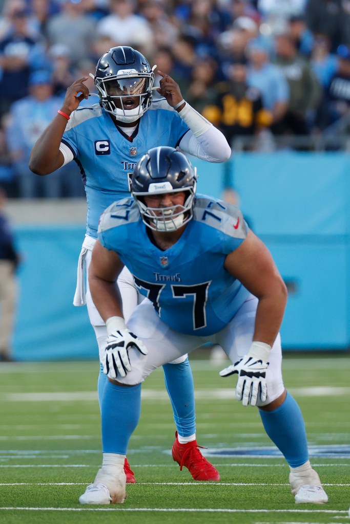 Tennessee Titans offensive tackle Peter Skoronski (77) prepares to block as quarterback Cam Ward (1) makes a play call during a game between the Tennessee Titans and Seattle Seahawks, November 23, 2025, at Nissan Stadium in Nashville, Tennessee. 