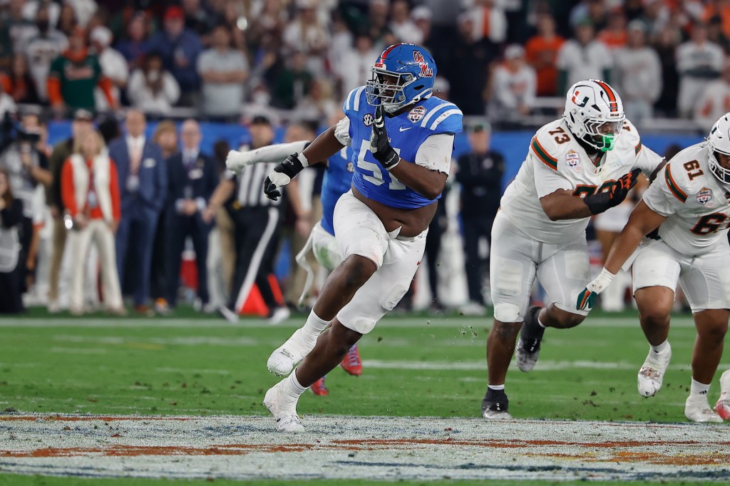Zxavian Harris #51 of the Ole Miss Rebels rushes during the Miami Hurricanes 