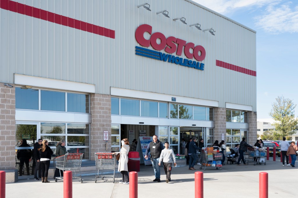 People entering and exiting a Costco Wholesale store.