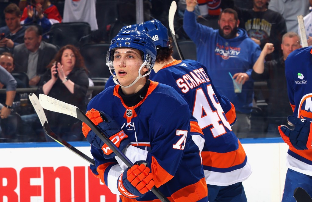 New York Islanders player #73 wearing a blue jersey and holding a hockey stick.