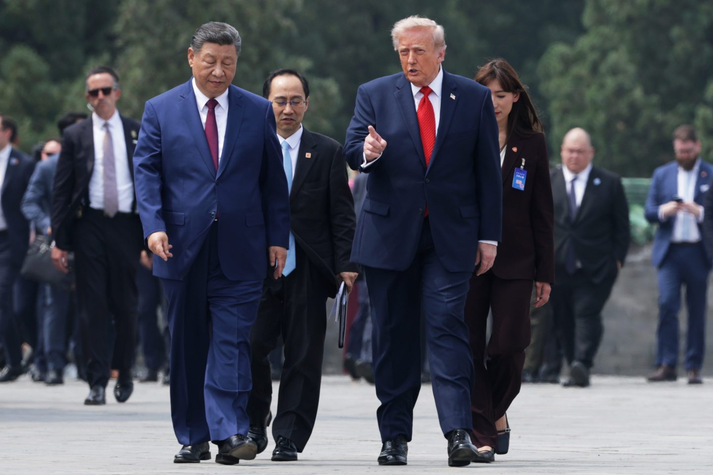 Donald Trump and Chinese President Xi Jinping walk side by side
