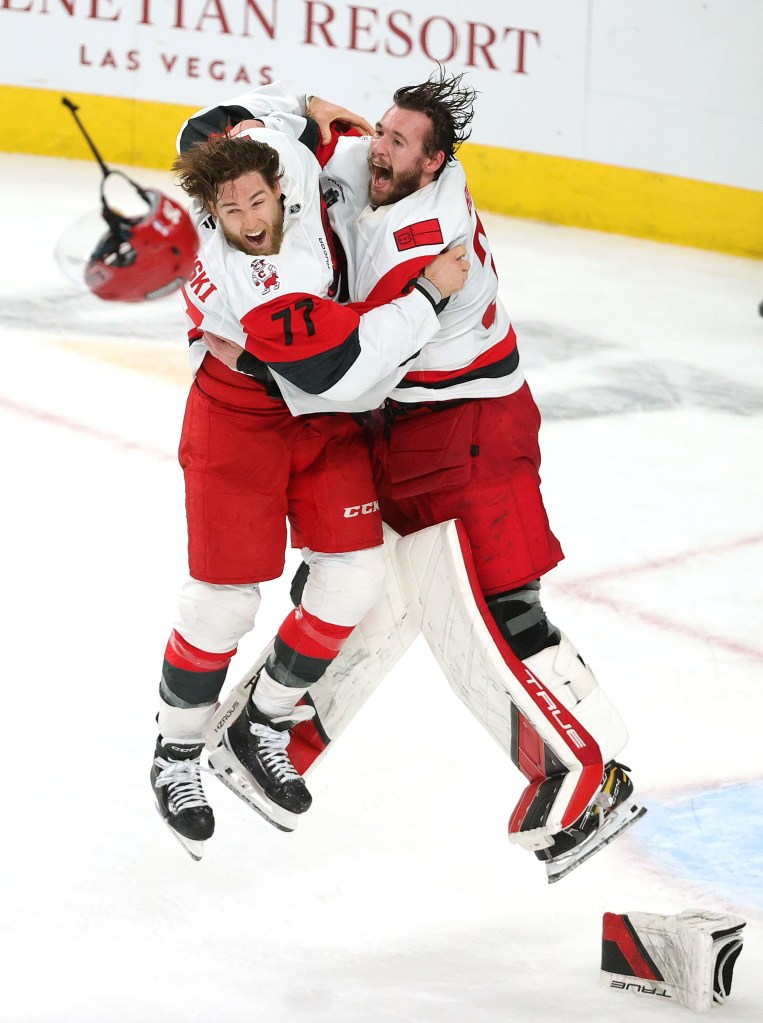 Mark Jankowski #77 and Brandon Bussi #32 of the Carolina Hurricanes hug after winning in Game Six of the 2026 Stanley Cup Final against the Vegas Golden Knights 3-0 at T-Mobile Arena on June 14, 2026 in Las Vegas, Nevada.