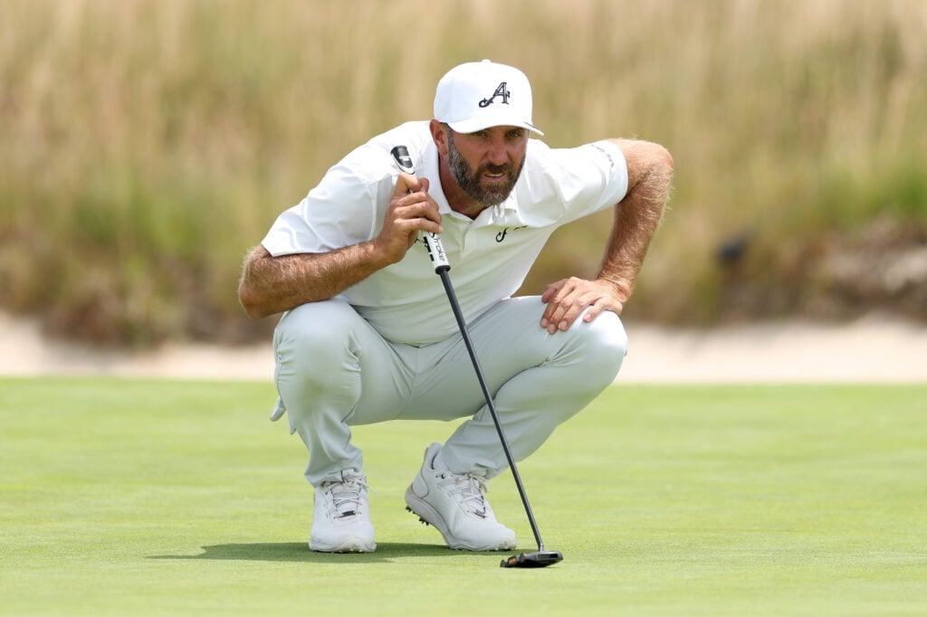 Dustin Johnson reads his putt during the second round of the US Open