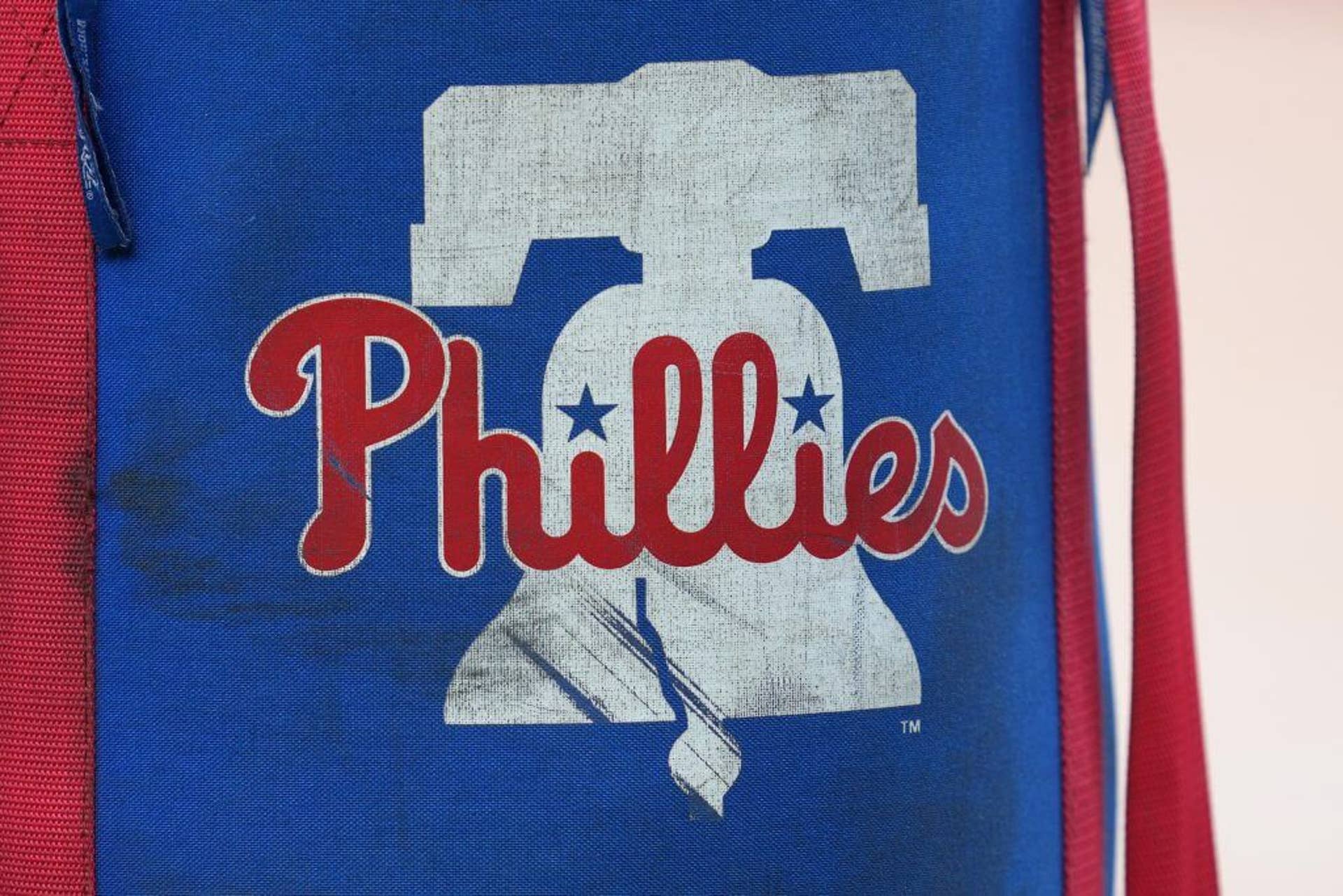 A close-up view of a Philadelphia Phillies logo on a ball bag.