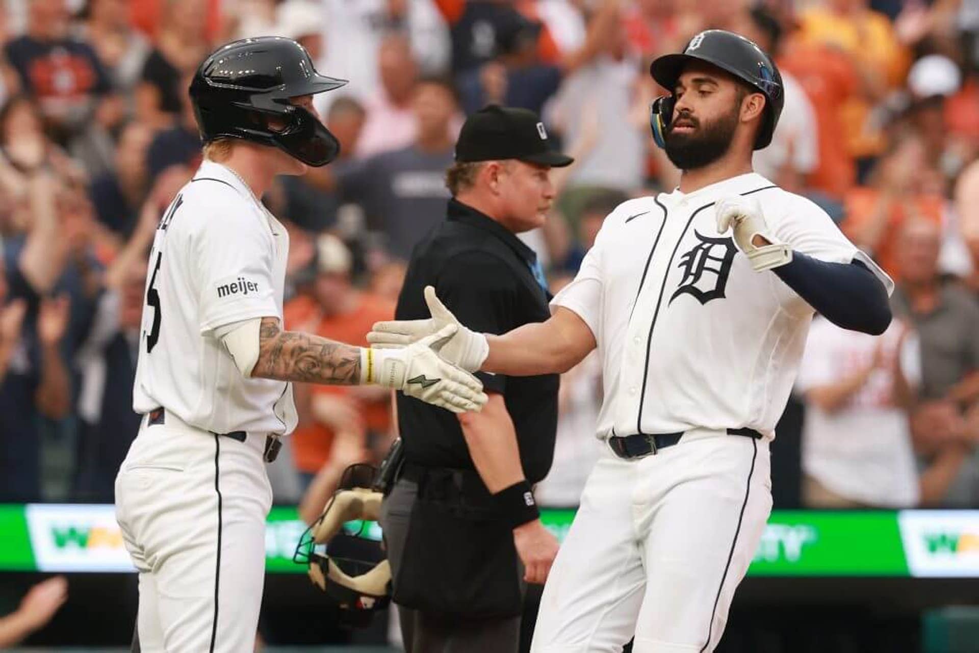 Riley Greene of the Detroit Tigers celebrates scoring a run in the second inning with Max Clark.