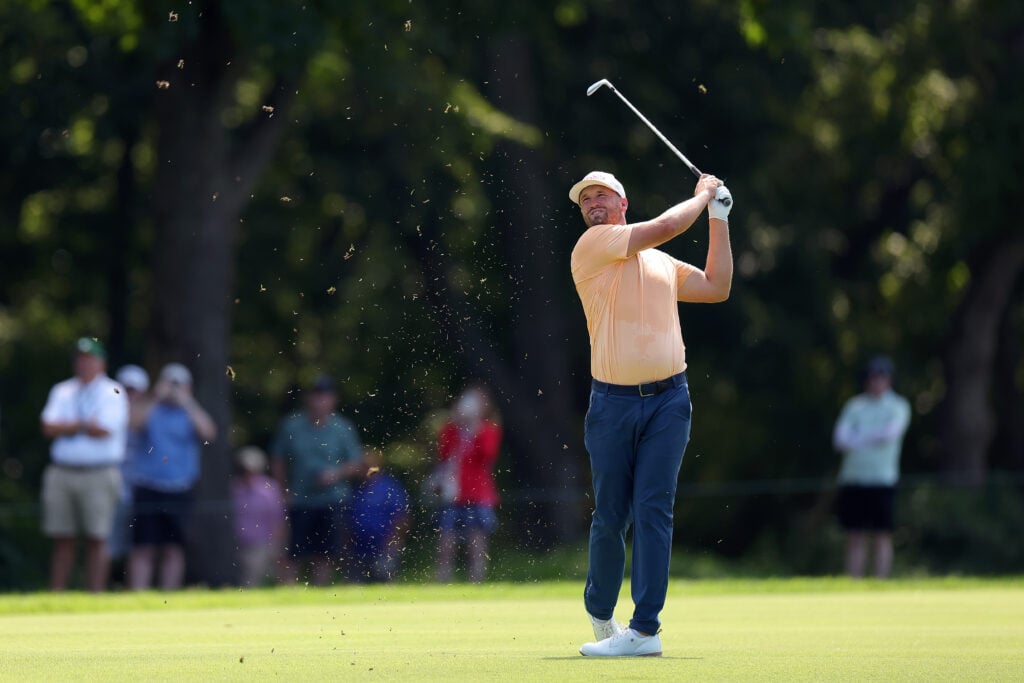 Wyndham Clark hits an approach during the first round of the BMW Championship